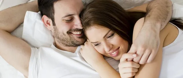 Young loving couple in the bed