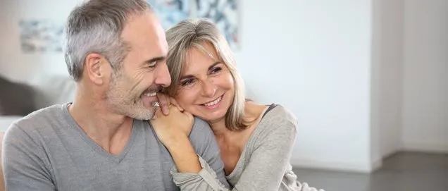 Romantic senior couple relaxing in couch