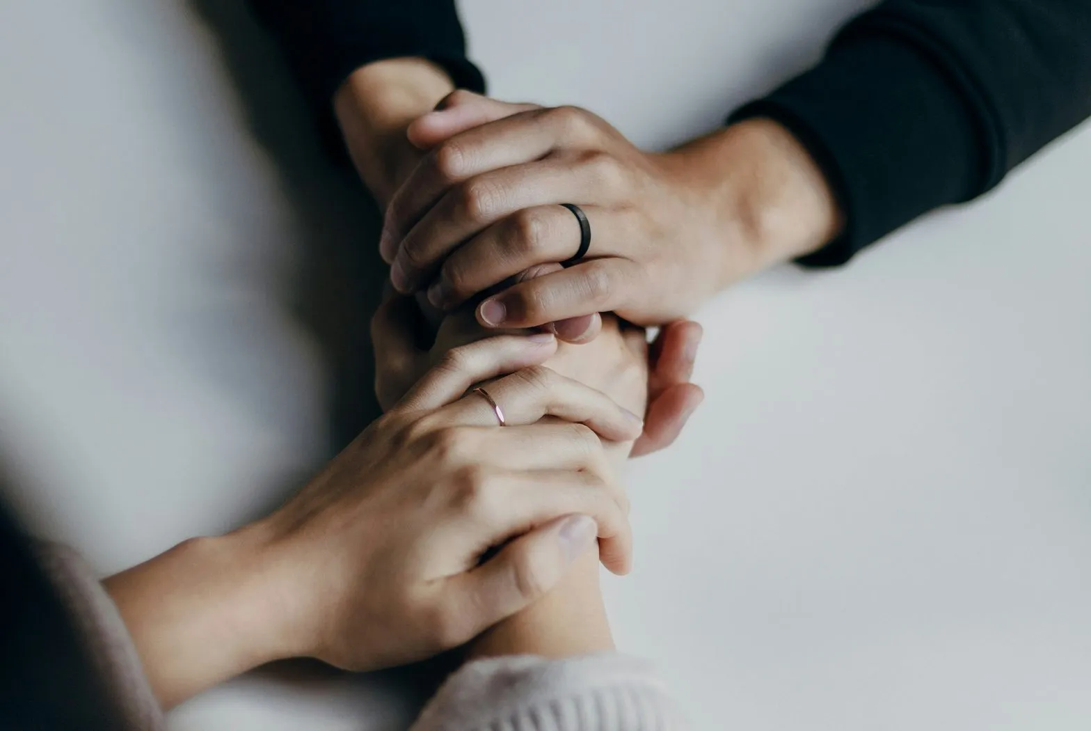 couple holding hands across a table
